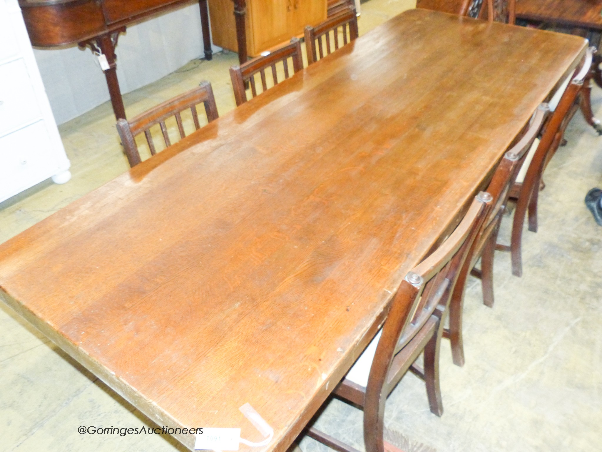 An 18th century style rectangular oak refectory dining table, width 230cm, depth 85cm, height 77cm